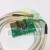 Zielona płytka drukowana YT-DA1 z podzespołami elektronicznymi, czujnikami i białym kablem z wtyczką.